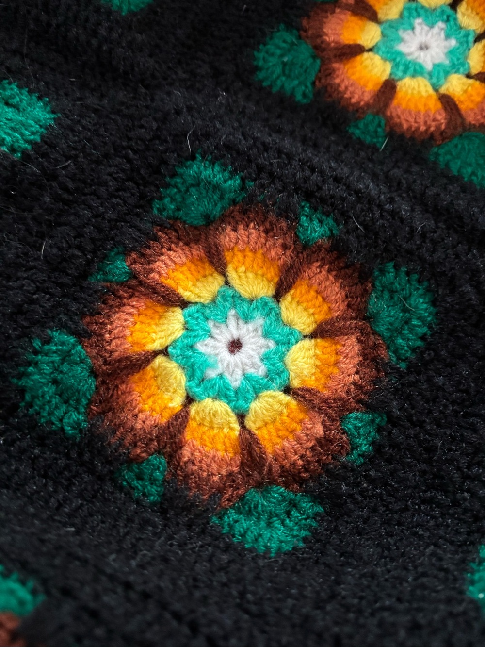 Handmade Black Crochet afghan with Green and Orange Floral Motif